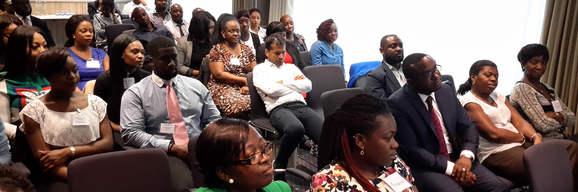 An audience listening at a historic Connect4Better community event