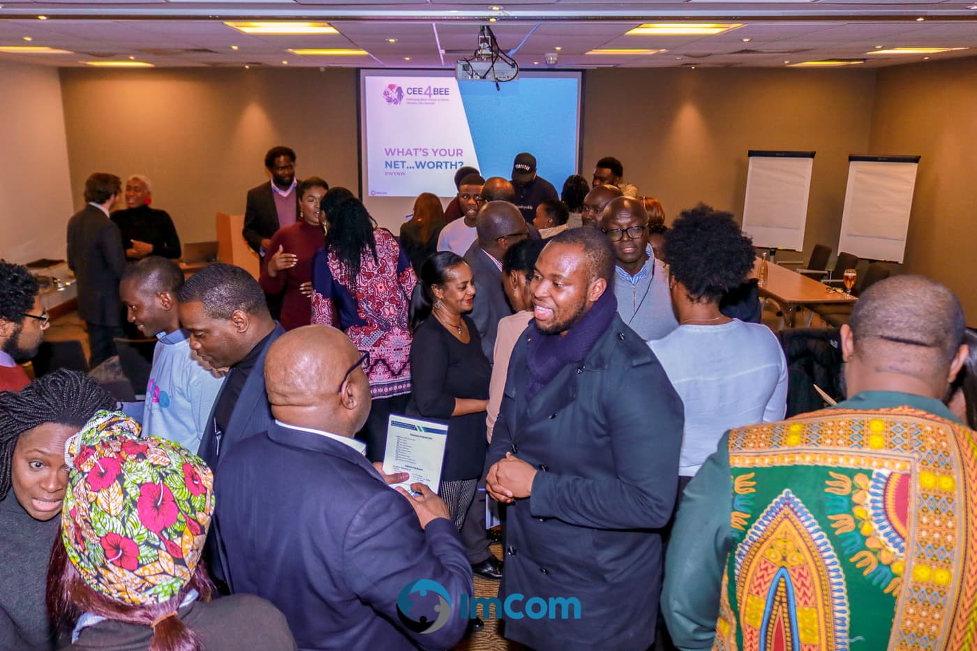 Attendees exchanging details during the networking hour