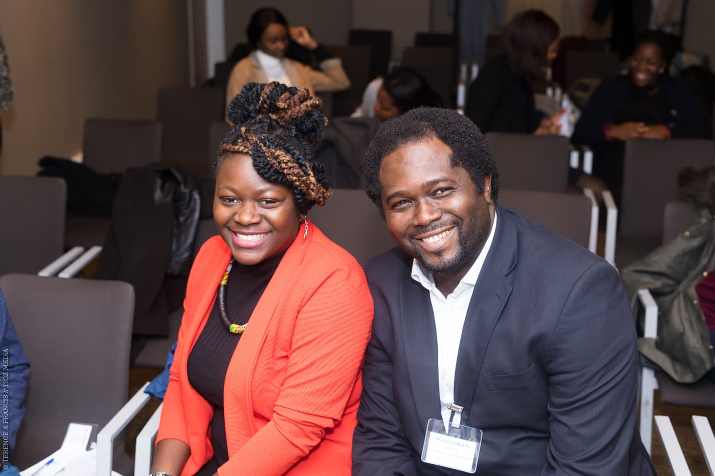 Two attendees smiling for the camera