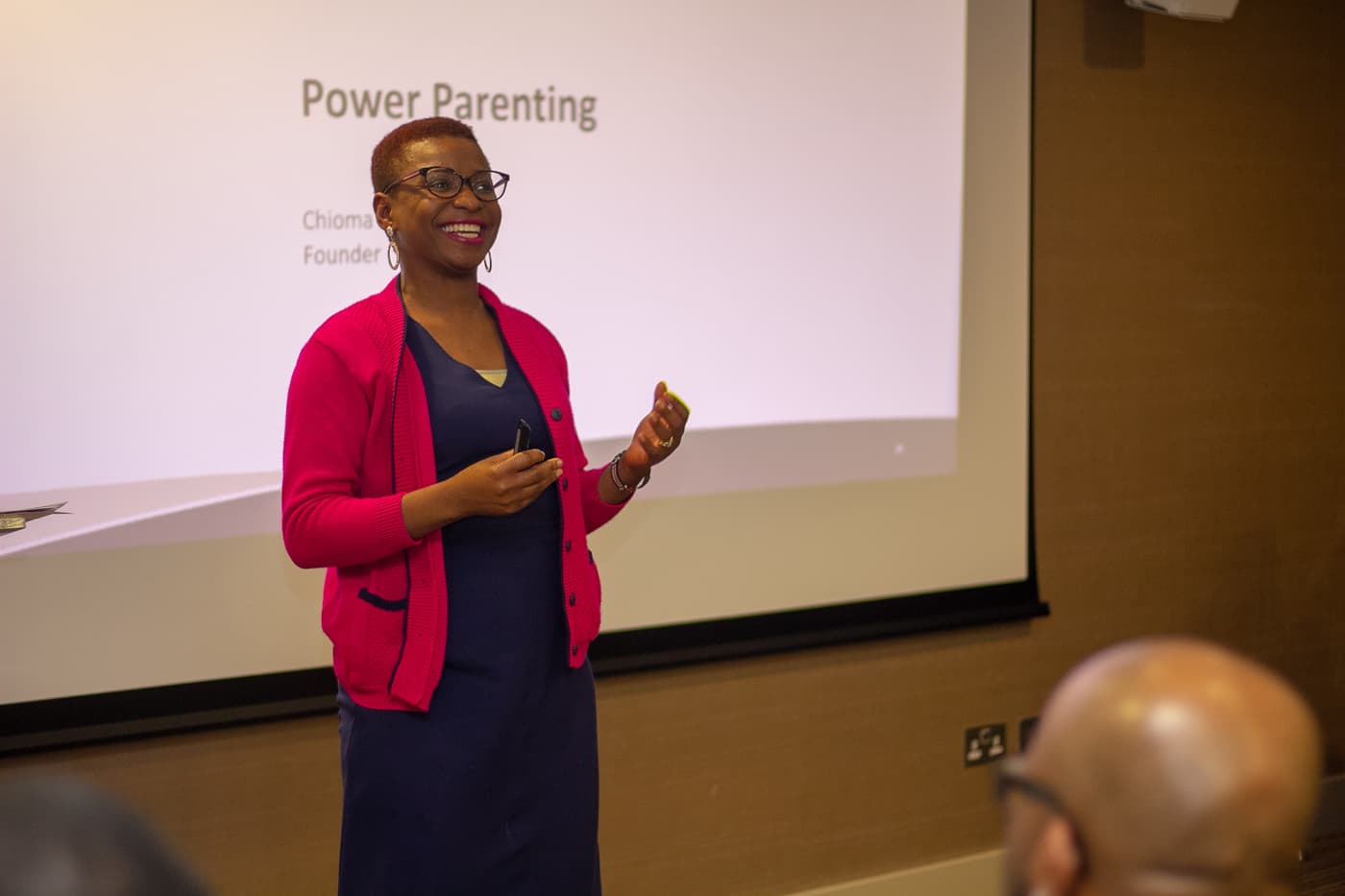 A speaker presenting to the room