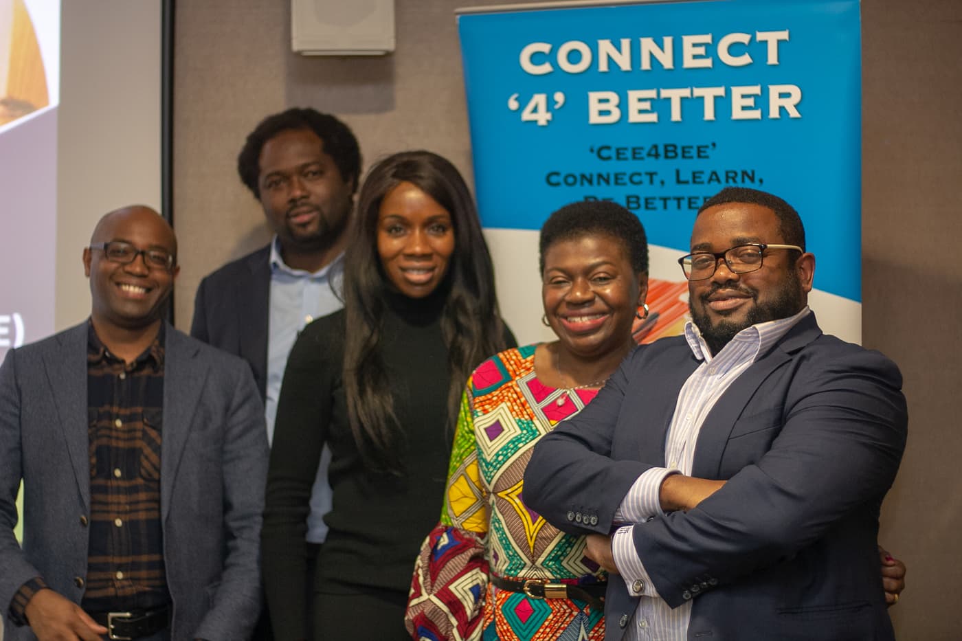 Organisers and speakers in front of the Connect4Better banner
